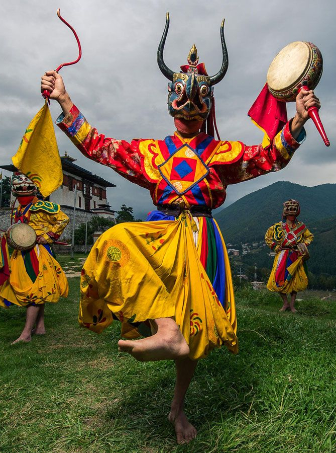 Bhutanese masked Cham dance at a traditional Tshechu festival